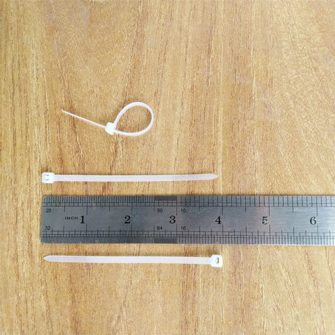 Heavy Duty 4 Inch Cable Ties 500 Pack With 40 Lbs Tensile Strength UV Resistant Self Locking Nylon Zip Ties next to ruler