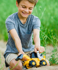 Child playing with Unstoppable Movers Front Loader With Realistic Lights And Sounds Motion Drive Technology Working Features Interactive Kid Friendly Construction Play For Ages 3 Plus.