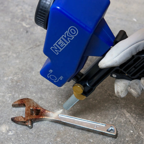 Air Sand Blaster Gun With Gravity Feed for Quick Paint and Rust Removal in action on a rusty wrench with replaceable steel nozzle