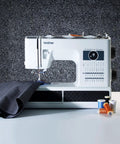 No Sweat Dead Simple Sewing Machine With 37 Built In Stitches And Automatic Needle Threader, white with fabric and thread spools.