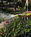 Close-up of Garden Hose Nozzle Kit, 3-Piece With Quick Connect Sprayer And Flow Stop Adapter watering garden plants