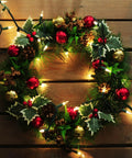 Festive wreath with Make Your Holiday Lit With A 35 Count Clear Extra Bright Mini Christmas Lights Set, decorated in red and gold.