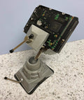 Vacuum Base Vise BV VB With Silver Finish holding electronic component on countertop, showcasing 360° swiveling head and stability