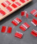 20 Pcs Self-Adhesive Clear Acrylic Hinges 35x25mm Mini Transparent Hinges for DIY Crafts on gray surface