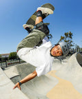Skateboarder wearing Old School Low Pro Certified Helmet with Deep Fit and SlimTech Core for Skateboarding, BMX, Cycling, Roller Skating