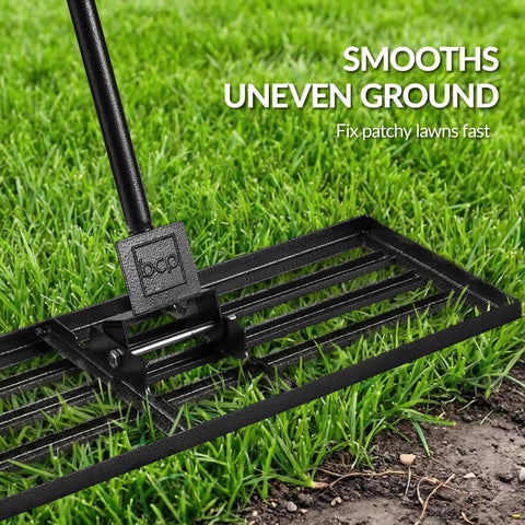Wide 30 By 10 Inch Lawn Leveling Rake With Heavy Duty Alloy Steel Frame And 78 Inch Handle For Smoothing Soil And Leveling Yards Gardens Landscaping And Golf Course Prep shown on grass