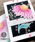 Handcrafted birthday card featuring a pink flower on a black background with scalloped borders from a 24 piece nesting frame die cut set.