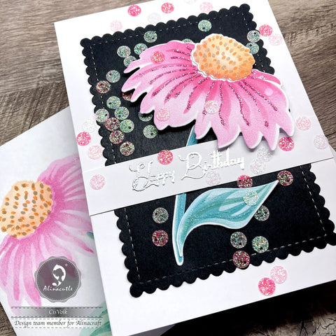 Handcrafted birthday card featuring a pink flower on a black background with scalloped borders from a 24 piece nesting frame die cut set.