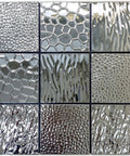Close-up of Stainless Steel Peel And Stick Backsplash Tiles 10 Sheets 3D Carven Silver with various textures and patterns.