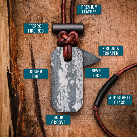 Viking Spark Whetstone Sharpener And Fire Starter Necklace on wood surface, showing ferro rod, zirconia scraper, and leather cord.