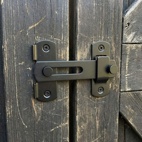 Barn Door Lock Set With Sliding Door Hardware In Carbon Steel Black Finish installed on a wooden barn door