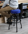 Heavy-Duty Steel Garage Shop Stool With Swivel Cushion Seat, Four Sturdy Legs, 360 Degree Foot Rings, Black Powder Coated Frame And Footrest, Single Pack in use at workbench