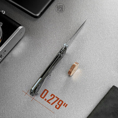 Ultra Thin EDC Knife With 2.9 Inch S35VN Blade And Titanium Handle shown closed on desk with 0.279 inch thickness