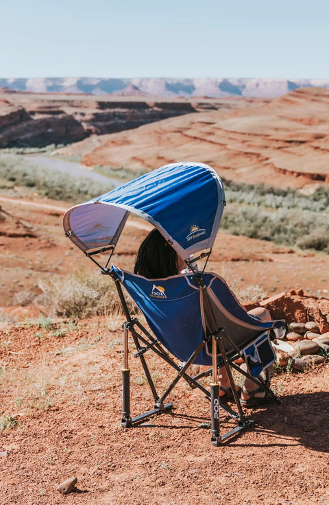 Pod Rocker Outdoor Rocking Chair With SunShade Canopy overlooking scenic red canyon landscape