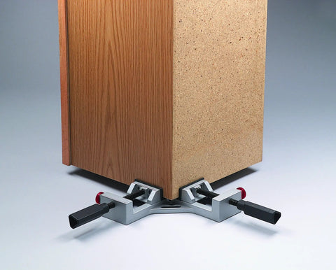 Quick-Jaw Right Angle Corner Clamp holding two boards at 90 degrees, showing 3-inch jaw face and ergonomic handles with quick-release.