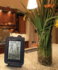Wireless Weather Station With Wind Sensor For Backyard Forecasts And Atomic Clock Time Sync on kitchen counter display