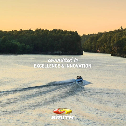 Boat cruising on a river at sunset, surrounded by trees, with the text 'committed to excellence & innovation' overlayed.
