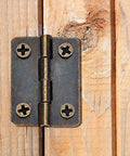 Two Size Bronze Mini Hinge Set With 60 Small Hinges And 300 7 Mm Screws In Clear Storage Box for Dollhouse Doors Cabinets Crafts Wooden Jewelry Boxes and Outdoor Decor Totally DIY Ready installed on wood surface.