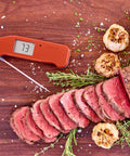 Top Rated No. 1 Instant-Read Thermometer For Precision Cooking, One-Second Read, Cayenne Pepper Red next to sliced roast beef