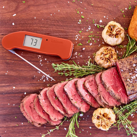 Top Rated No. 1 Instant-Read Thermometer For Precision Cooking, One-Second Read, Cayenne Pepper Red next to sliced roast beef