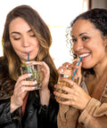 Jumbo Cocktail Straws Black With Blue Stripe 5.75 Inches Wrapped 6000 Count Compostable Marine Biodegradable Non Toxic Made In USA 6 Pack Eco Friendly Barware For Parties And Backyard Hangouts, women using blue straws