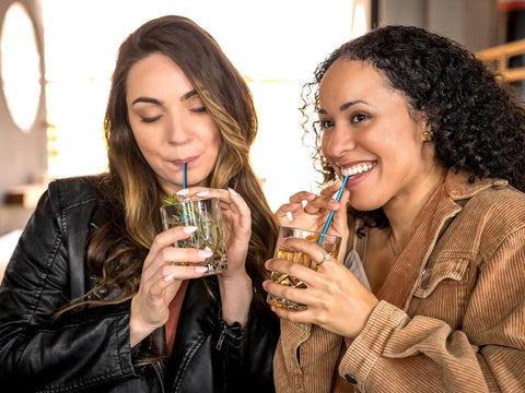 Jumbo Cocktail Straws Black With Blue Stripe 5.75 Inches Wrapped 6000 Count Compostable Marine Biodegradable Non Toxic Made In USA 6 Pack Eco Friendly Barware For Parties And Backyard Hangouts, women using blue straws