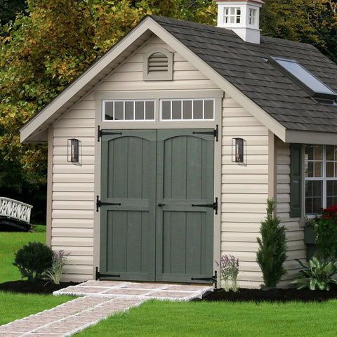 Solid Brass Outdoor Wall Lantern Sconce With Tempered Glass on shed exterior, showcasing weatherproof lighting design.
