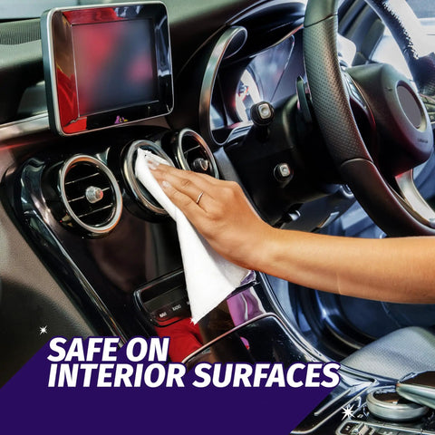 Person using Auto Wipes For Cars And Screens Quick Streak Free Shine Ammonia Free Cleaner Wipes on car dashboard and screen