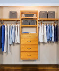 Custom Cut Wall Mounted Closet Organizer System Featuring Heavy Duty Wooden Shelving And Four Deep Soft Close Drawers With Slick Sliding Tracks Crafted From Pure Maple Wood For Top Shelf Walk In Storage with hanging shirts.