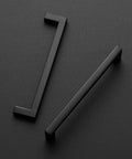30 Pack Solid 5 Inch Center to Center Slim Square Bar Drawer Handles Matte Black for Kitchen Cabinets on dark surface