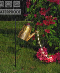 Solar Watering Can Lights Outdoor Garden Decor Large Waterproof Cascading LED Hanging Lights With Copper Wire in rain by flowers