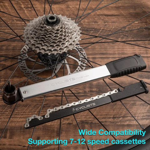 Two In One Chain Whip And Lockring Tool For Cassettes with Shimano HG and SRAM compatibility displayed on a wooden surface
