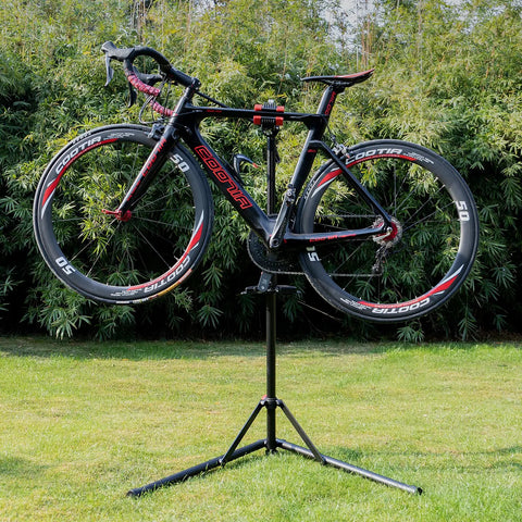 Heavy Duty Bike Repair Stand For Mountain And Road Bikes, Portable Maintenance Workstand holding a bicycle outdoors