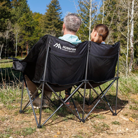 Two Person Oversized Camping Chair Loveseat For Adults Heavy Duty Folding Outdoor Couch Black Portable Patio Lawn Chair Great For Campsites Backyards And Decks Cozy Two Seat Camp Sofa with couple outdoors
