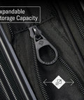 Close-up view of black Samsonite Omni 2 luggage zipper on fabric, expandable storage feature