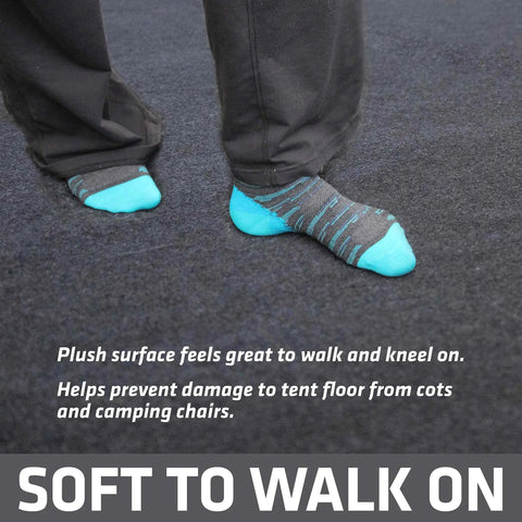 Soft Plush Tent Carpet Mat With Waterproof Backing Keeps You Warm And Dry Inside The Tent shown with feet on charcoal mat