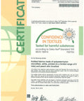Front view of a textile testing certificate with Confidence in Textiles seal and signatures.