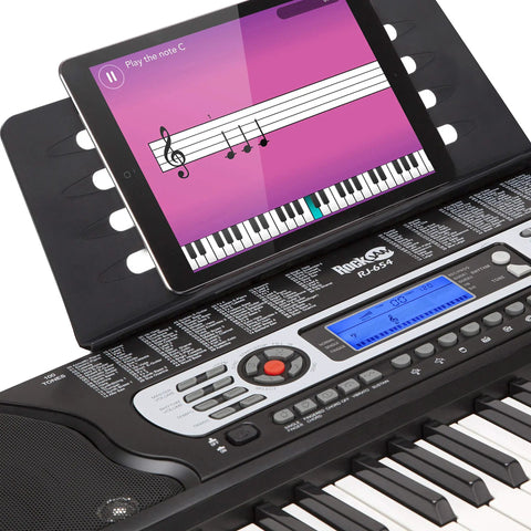 54 Key Keyboard Piano Kit With Power Supply, Sheet Music Stand, Note Stickers And Lessons For Beginners showing tablet lesson
