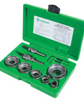Greenlee 648 Quick Change Carbide Hole Saw Set For 1/2 To 2 Inch Conduit in green case with cutting heads and arbors.