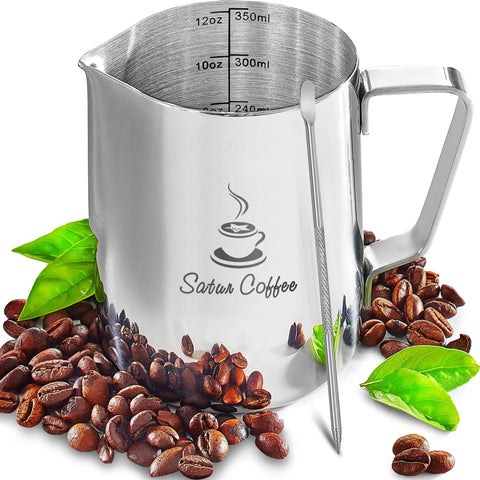 Stainless Steel Milk Frothing Pitcher 12oz 350ml With Dual Inside Measurement Scales For Precise Pouring And Latte Art Espresso Cappuccino Coffee Steaming Jug Plus Ebook Included surrounded by coffee beans and leaves