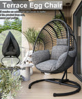Cozy Hanging Egg Chair With Stand For Indoor And Outdoor Living, perfect patio or balcony chill spot, wicker swing hammock with UV resistant cushions, sturdy steel frame, 400 lb capacity for backyard relaxation shown on a balcony.