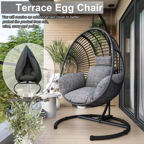 Cozy Hanging Egg Chair With Stand For Indoor And Outdoor Living, perfect patio or balcony chill spot, wicker swing hammock with UV resistant cushions, sturdy steel frame, 400 lb capacity for backyard relaxation shown on a balcony.