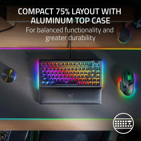 Slick Compact 75 Percent Mechanical Gaming Keyboard With Hot Swap Sockets Crisp Orange Tactile Switches Dope Chroma RGB Lighting Aluminum Frame Clutch Volume Knob Plush Wrist Rest Perfect For Any Modern Desk Setup Renewed Black on a dark desk with RGB lighting.