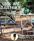 Portable Folding Camping Table With Adjustable Aluminum Legs set up outdoors with chairs and camping gear, height adjustable 24.79-29.99 in