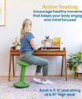 Person seated on Sitwell Wobble Stool With Cushion Adjustable Height Active Seating For Movement Perfect For Class Or Home Grassy Green