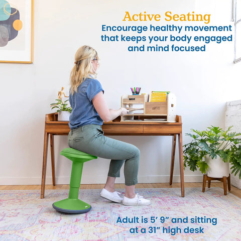 Person seated on Sitwell Wobble Stool With Cushion Adjustable Height Active Seating For Movement Perfect For Class Or Home Grassy Green
