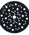 A round black pad protector with multiple holes for sanding blocks, part of Six Inch Pad Protectors For Sanding Blocks Five Pack Velcro Pad Saver Hook And Loop Shield Keeps Sander Plate Safe And Velcro Surface Intact Easy Attach To Grinding Plate.