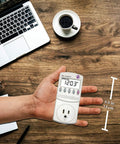 Hand holding Electricity Usage Monitor With Big LCD Display Four Settings For Day Week Month And Year Power Tracking Easy Readout