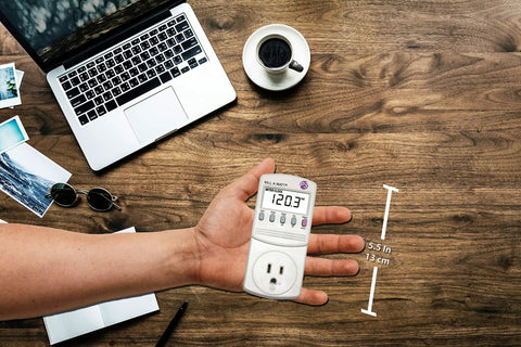 Hand holding Electricity Usage Monitor With Big LCD Display Four Settings For Day Week Month And Year Power Tracking Easy Readout
