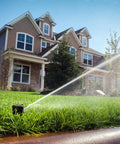 Tough As Nails Gear Drive Pop Up Lawn Sprinkler Boasting Preinstalled Number 6 Nozzle watering grass in residential lawn.